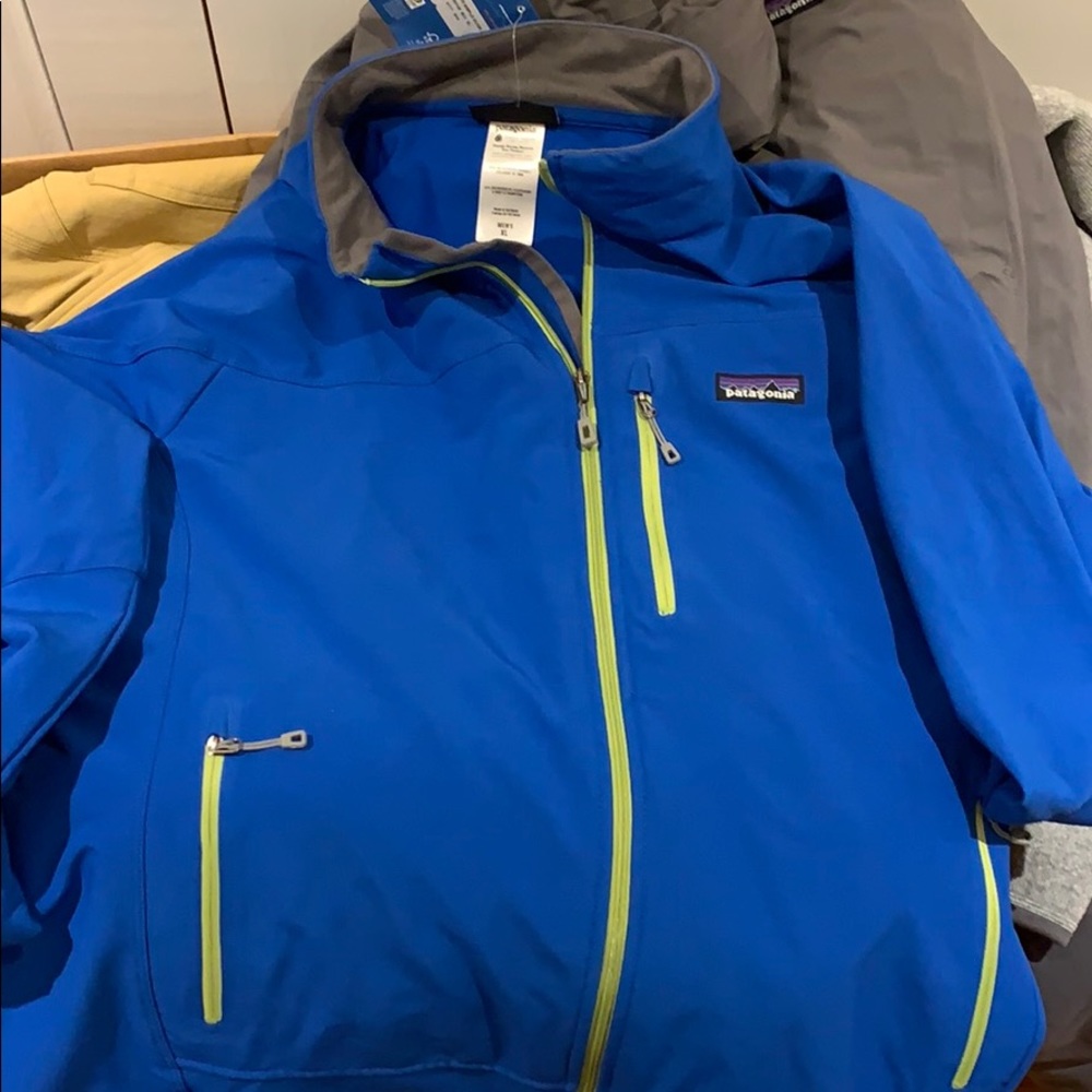 Blue jacket. Hidden hood in back.